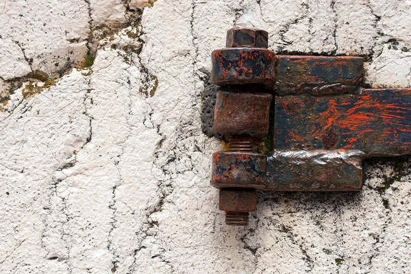 Rusty Hinge on white Rock — Stock Photo, Image