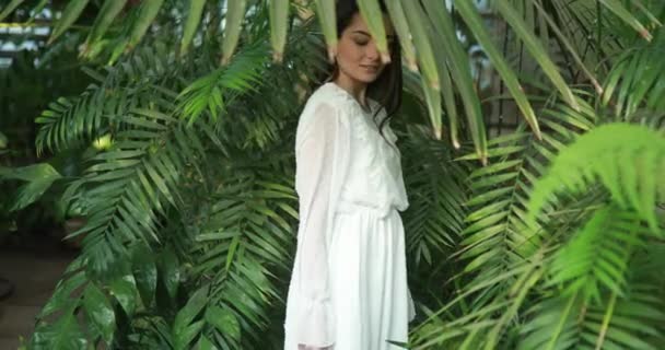 Young Woman White Dress Relaxes Rests Orangery Background Green Tropical — Stock Video
