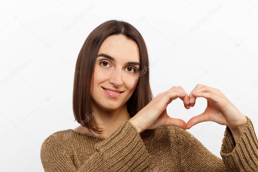 Love all you need. Charming romantic charismatic passionate girl brown eyes show heart gesture confessing sympathy look friendly camera smiling,