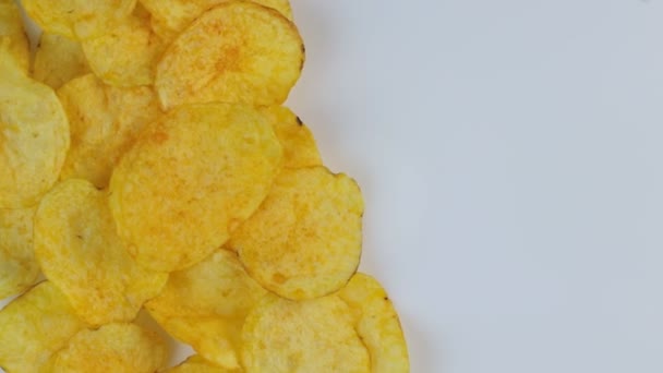 Classic potato chips rotate on a white background. Space for text. — Stock Video