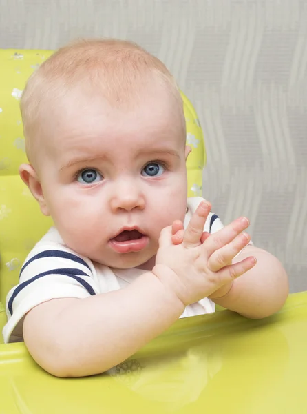 Baby in highchair — Stock Photo, Image