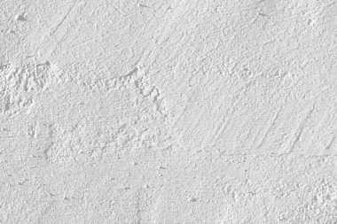 Beyaz beton duvar dokusu arka plan. Eskimemiş, alçı beyazı, beton duvar dokusu arka planı. Güneşin altında pürüzlü bir duvar..
