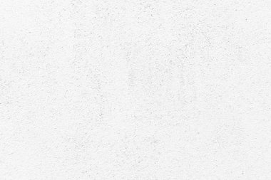 Beyaz beton duvar dokusu arka plan. Eskimemiş, alçı beyazı, beton duvar dokusu arka planı. Güneşin altında pürüzlü bir duvar..