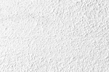 Beyaz beton duvar dokusu arka plan. Eskimemiş, alçı beyazı, beton duvar dokusu arka planı. Güneşin altında pürüzlü bir duvar..