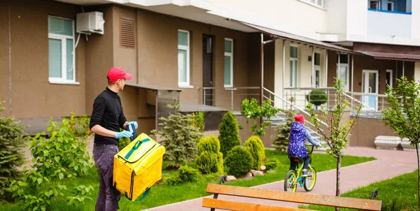 delivery, mail and people concept happy man delivering food in disposable paper bag to customer home