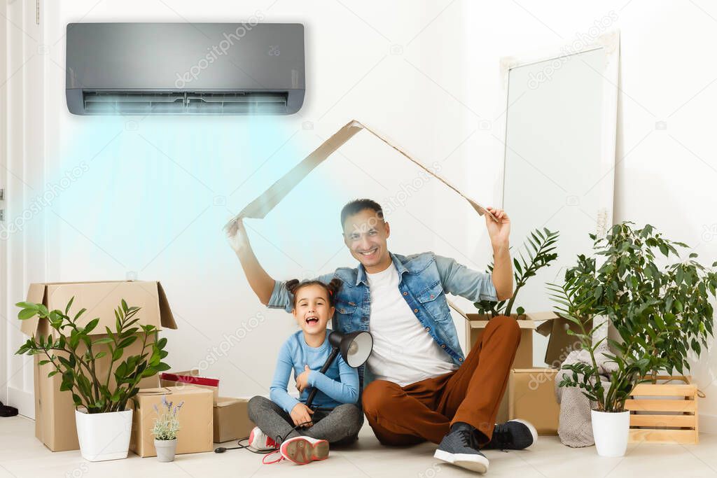 air conditioning in living room with happy family moving to new apartment