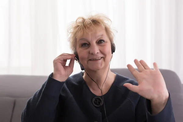 elderly woman senior at the computer communicates laptop, grandmother