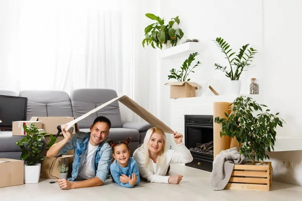 Happy young family under a safe roof, concept