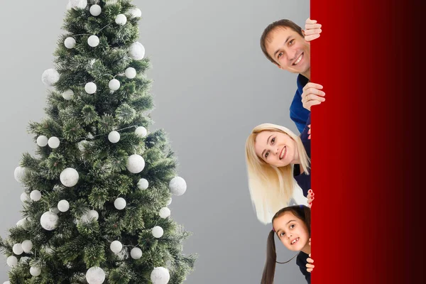 Family Peeks Out Christmas Tree Decorated Toys Family Peeps Winter — Stock Photo, Image