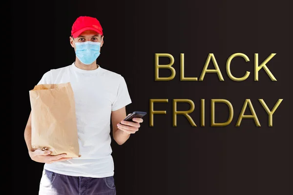 black friday and the delivery man. Delivery concept. Delivery service concept. Copy space. Black friday concept.