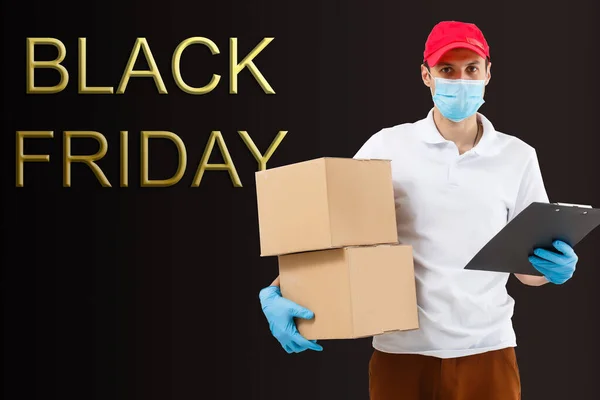 black friday and the delivery man. Delivery concept. Delivery service concept. Copy space. Black friday concept.