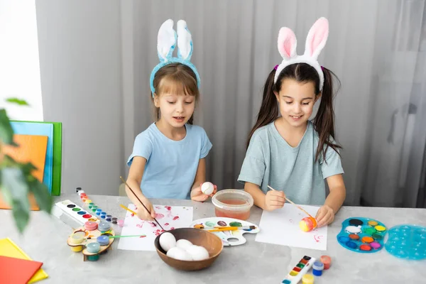 Two Happy Cute Girls Sisters Paint Easter Eggs Laugh Show — Stock Photo, Image