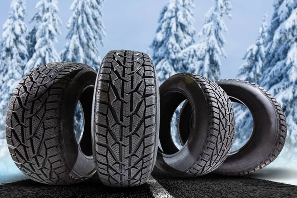 Stack Four New Black Tyres Winter Car Blue Background — Stock Photo, Image