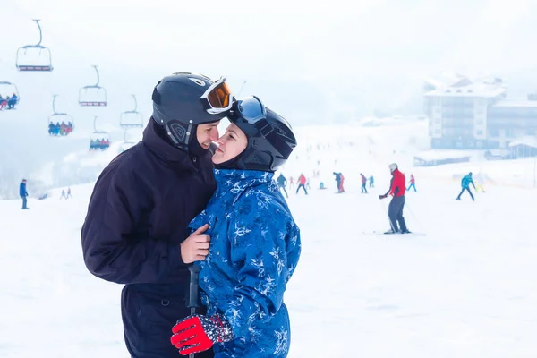 Middle Aged Couple On Ski Holiday In Mountains