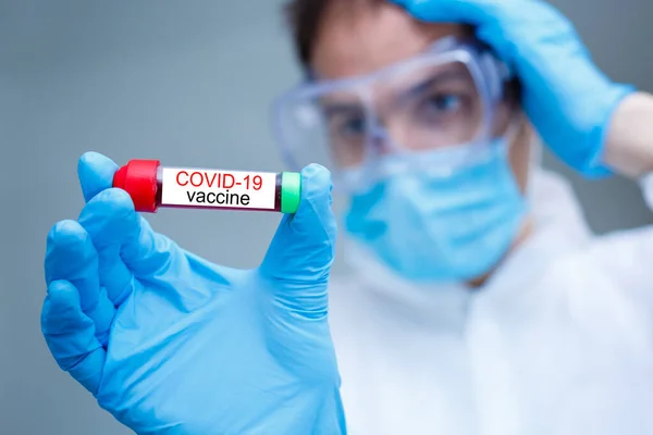 Man Wearing Penis Holding Covid Vaccine — Stockfoto