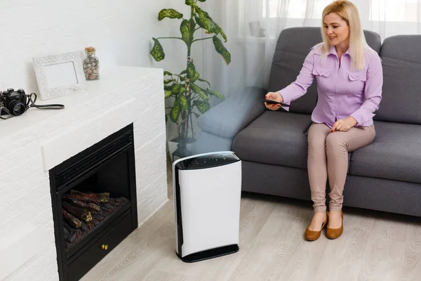 Young Woman Relaxing Couch While Air Humidifier Purifier Working Foreground — Stock Photo, Image