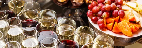 glasses with white and red wine close-up before party in cafe