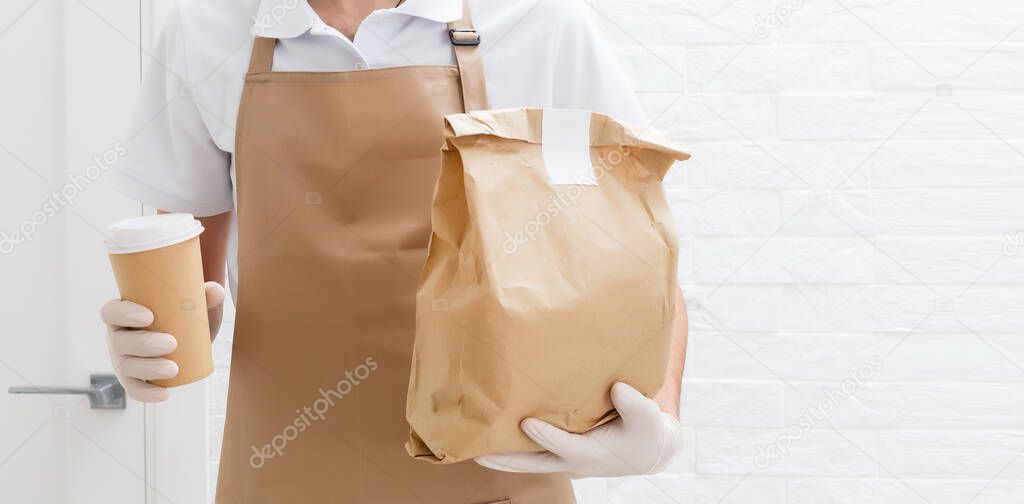 Diverse of paper containers for takeaway food. Delivery man is carrying. High quality photo
