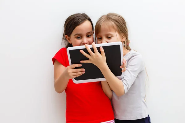 Picture Two Beautiful Girls Tablet White Background — Stock Photo, Image