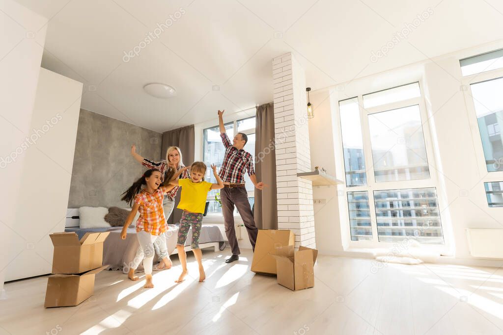 Happy family in a new house. Real estate and moving background.