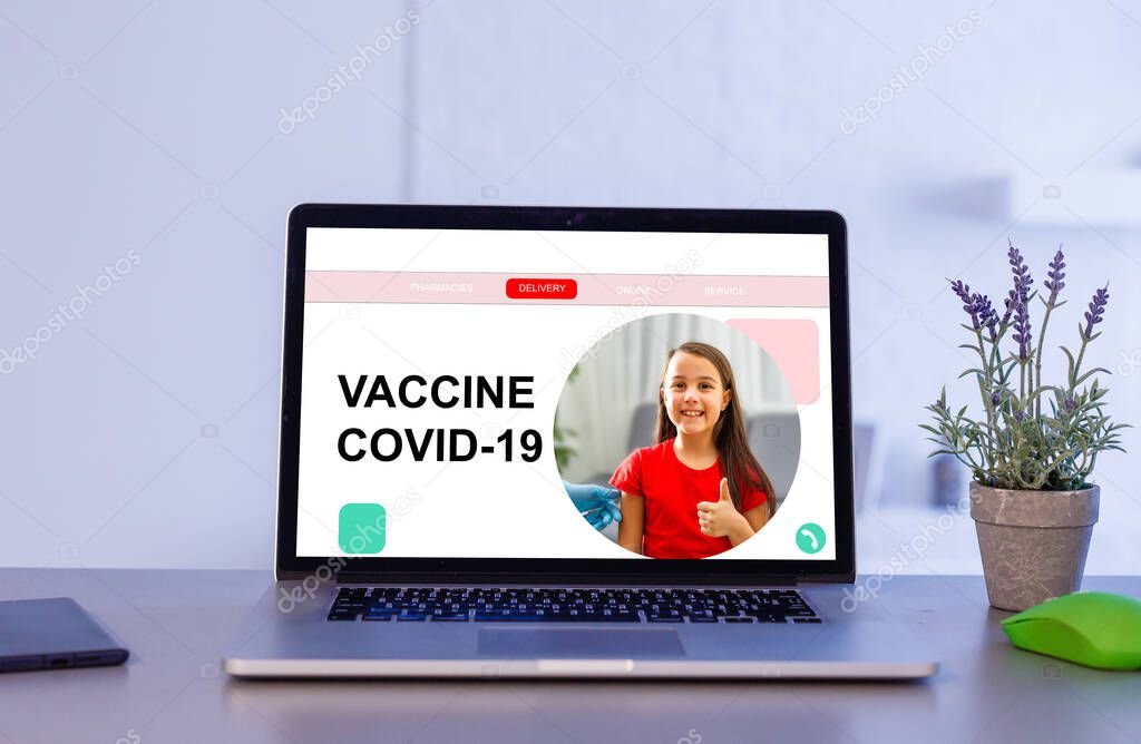 on the laptop monitor information about vaccination against Covid-19