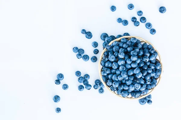 Blueberries in bamboo basket on white background — Stock Photo, Image