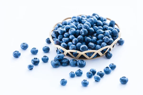 Blueberries in bamboo basket on white background — Stock Photo, Image