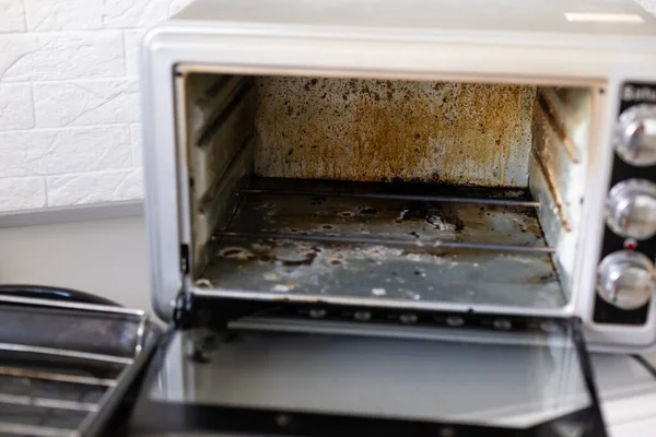 dirty oven, electric oven in fat