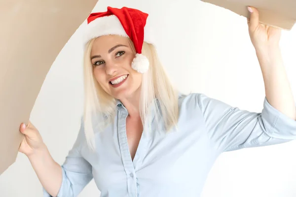 Pleasant woman opening cardboard box — Stock Photo, Image