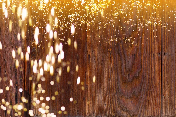 Gouden bokeh lichten met houten achtergrond abstracte desing — Stockfoto