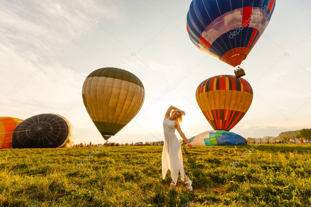 A tourist woman enjoying wonderful view of the balloons. Happy Travel concept