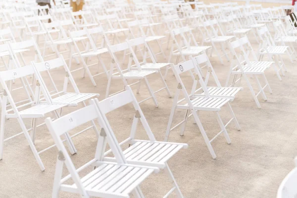 Social distancing during Covid or Coronavirus crisis, chairs keeping distance during a show, concert or exhibition, theater or cinema — Stock Photo, Image