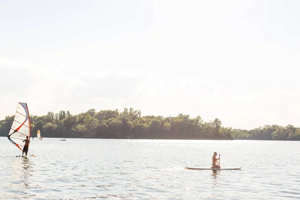 Action Shot of Young Woman on Paddle Board — Stock Photo, Image