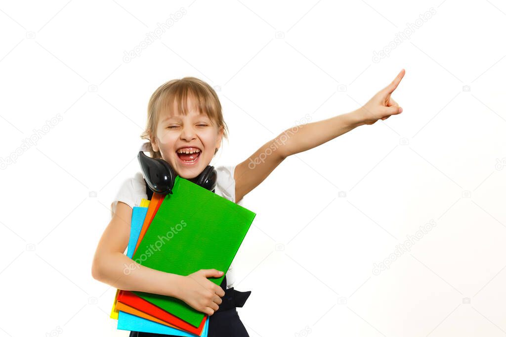 Blonde schoolgirl holds large book, shoot over white background