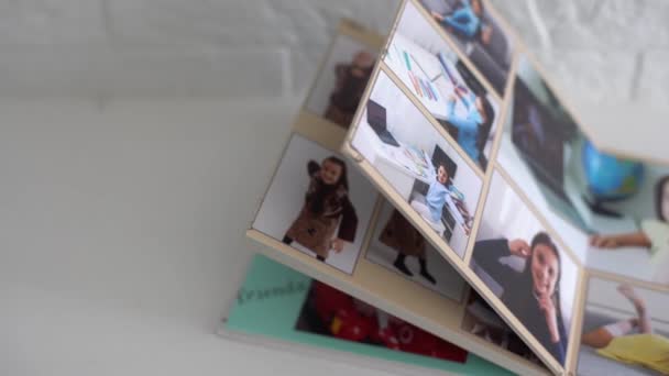The photo album is decorated in a beautiful photobook. Presented on a white background — Stock Video