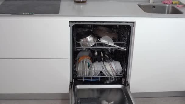 Open dishwasher with clean utensils in it. — Stock Video
