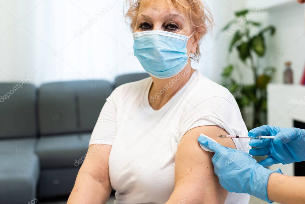 female senior getting an swine flu shot