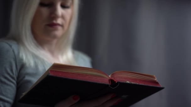 Closeup portrait of a young woman praying — Stock Video