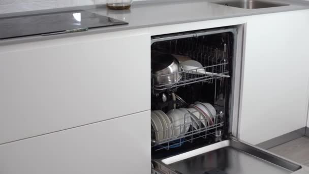 Open dishwasher with clean utensils in it. — Stock Video