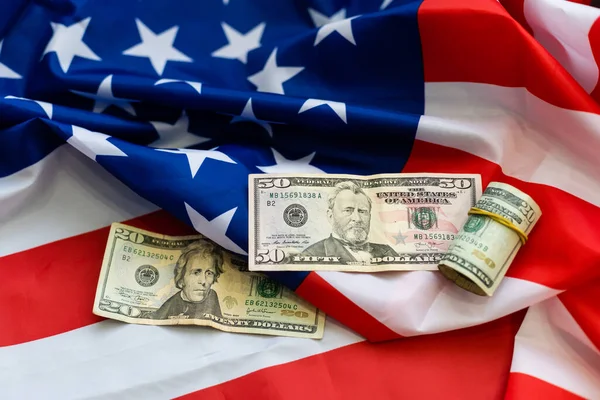 top view american flag on us dollars background