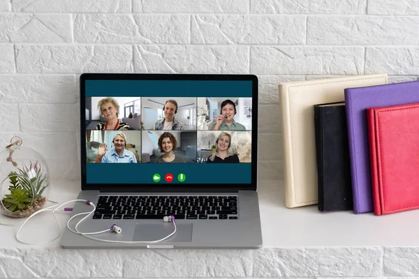 Virtual meeting online. Video conference by laptop. Online business meeting. On the laptop screen, people who gathered in a video conference to work on-line