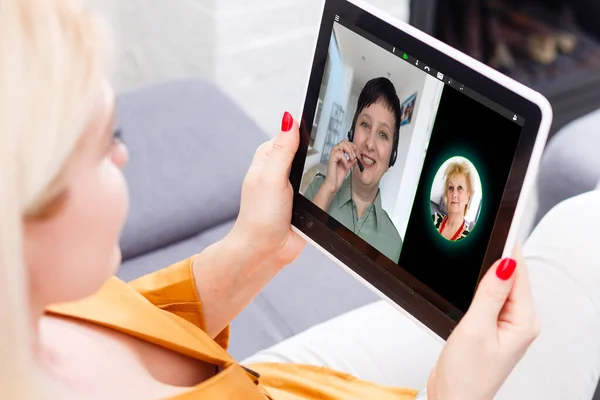 Virtual meeting online. Video conference by laptop. Online business meeting. On the laptop screen, people who gathered in a video conference to work on-line