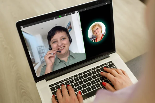 Virtual meeting online. Video conference by laptop. Online business meeting. On the laptop screen, people who gathered in a video conference to work on-line