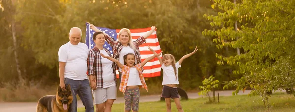 Family Posing Outdoors With American Flag — Stock Photo, Image