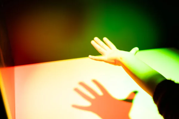 Prism rainbow light and shadow of a hand — Stock Photo, Image