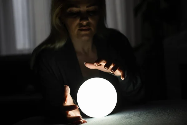 A fortune teller gazes into her ball — Stock Photo, Image