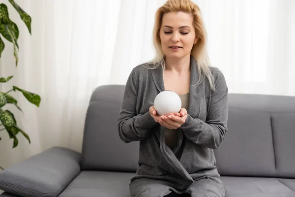 A fortune teller gazes into her ball — Stock Photo, Image