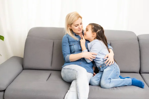 Mother smiling with her daughter at home — Stock Photo, Image