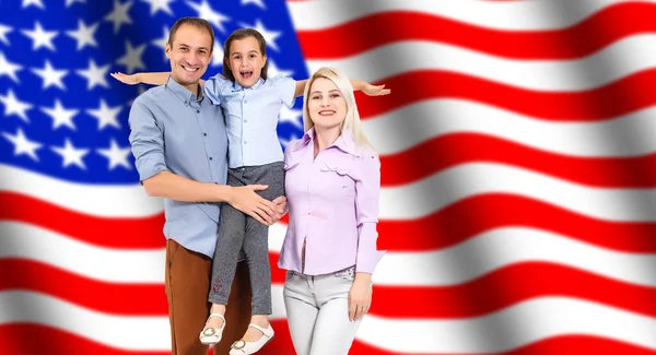 Portrait of beautiful modern american family with USA flag. — Stock Photo, Image