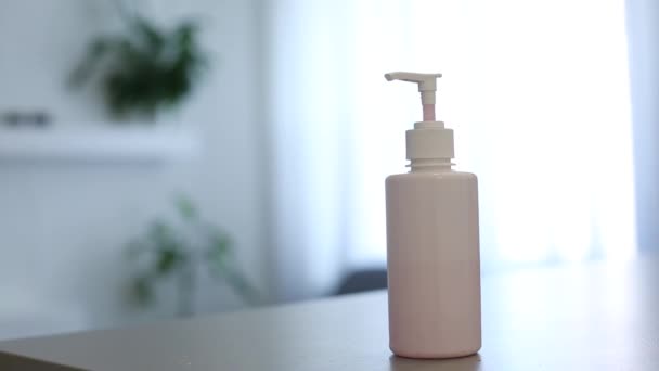 Female Uses Hand Sanitizer Close Up. a close up view of a woman using and rubbing in hand sanitizer into her hands — Stock Video